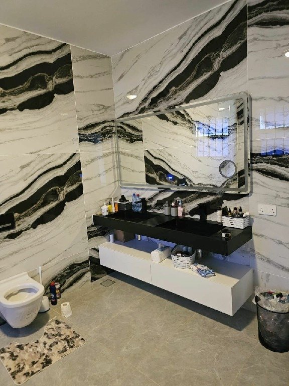 spacious luxury bathroom with double sink & floating cabinets~1
